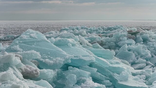 
Hummocks on the Kapchagai reservoir. Ice blocks covering the lake. Winter time. The view from the drone.