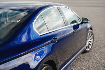 Naklejka premium A modern, bright blue business class sedan. A comfortable, spacious and multifunctional car.