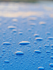 waterdrops seen in close up on a blue backrground