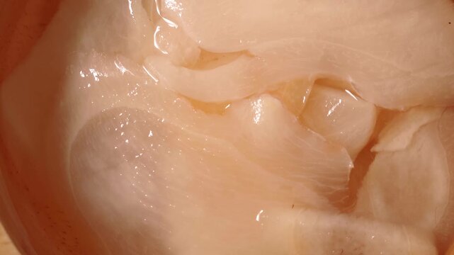 close-up of pickled ginger in a bowl.