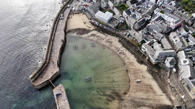 Aerial view Over Mousehole Harbour In Cornwall, UK.