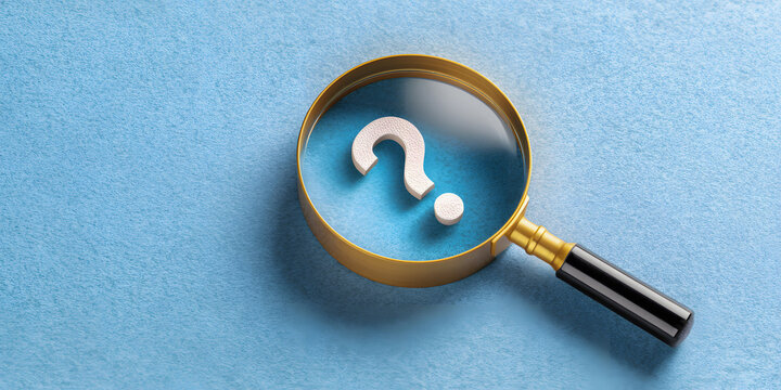 Magnifying glass enlarges question mark on blue background