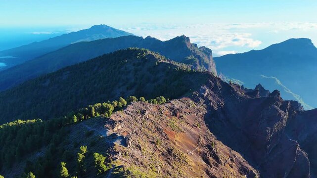 Aerial drone footage of mountain ridge during sunset at Roque de los Muchachos, La Palma