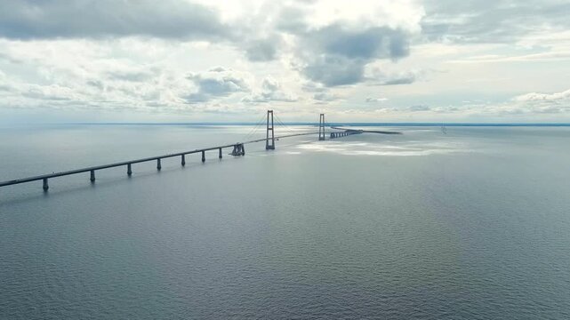 Korser, Denmark. Great Belt Bridge (Storebalt). Cloudy weather with gaps. Drone footage