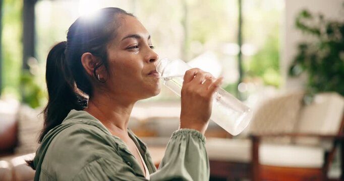 Wellness, laugh and woman drinking water in home for natural nutrients, thirsty and digestion. Flare, bottle and person with liquid beverage in morning for gut health, hydration or detox in apartment