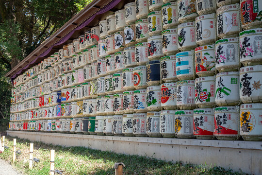 View of decorative sake barrels stacked in rows at Jingu shrine