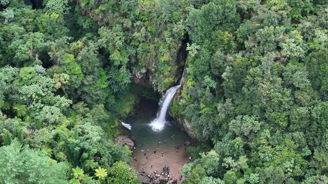 beautiful waterfall in Cuetzalan surrounded by forest, Puebla, Drone shot