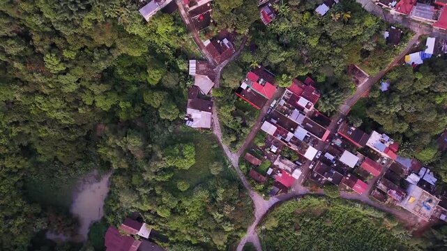 Cuetzalan town homes surrounding greenery, Drone shot