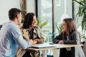 Coworkers enjoying coffee break and relaxed conversation