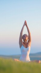 Young woman practicing yoga outdoors, joyful and relaxed, arms raised in a serene landscape with soft colors, open space for inspiration.