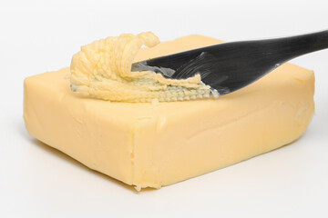 A cube of real butter isolated on a white background