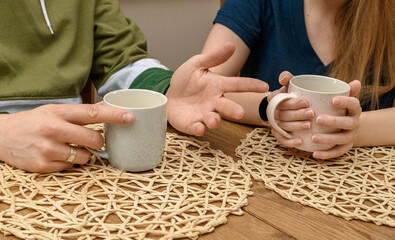 A couple chatting during a social gathering, meeting for coffee at a caf&eacute;