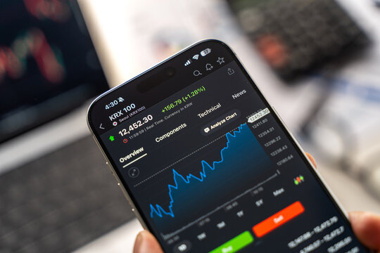 KRX or Korea Exchange logo is displayed on the screen of a smartphone, in Bangalore, India, on February 12, 2026