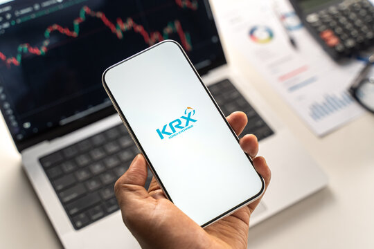 KRX or Korea Exchange logo is displayed on the screen of a smartphone, in Bangalore, India, on February 12, 2026
