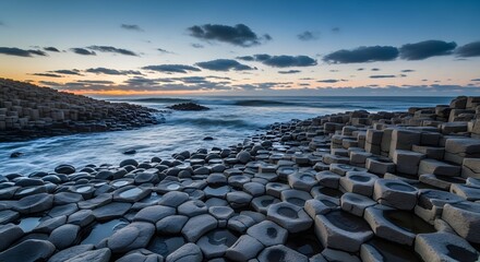 Fototapeta premium Serene coastal landscape with unique rock formations at dusk