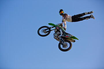 Motorcycle rider performing dangerous midair stunt trick in Almaty