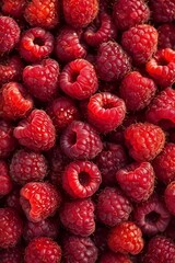 Fresh ripe raspberries close up, vibrant red berries background, natural organic fruit texture, healthy summer food concept.