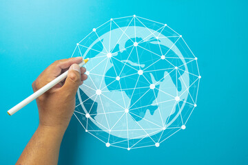 Global network connection and internet of things (IoT). Hand touching digital world map sphere. Symbol of communication, big data transfer, 5G technology, and future innovation.