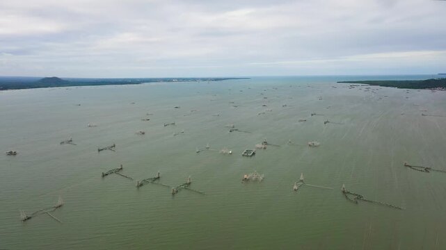 Traditional fish farm in the Philippines with wooden cages, view from above. Mindanao, Philippines.