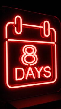 Vibrant red neon sign displaying a calendar icon with '8 DAYS' text glowing