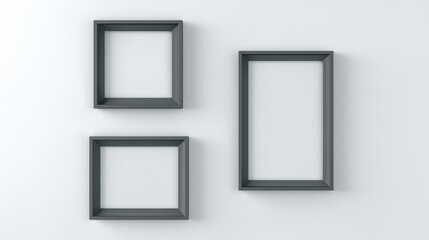 Three empty frames hang neatly on a plain wall,