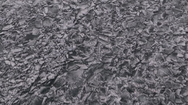 

Hummocks on the Kapchagai reservoir. Ice blocks covering the lake. Winter time. The view from the drone. 