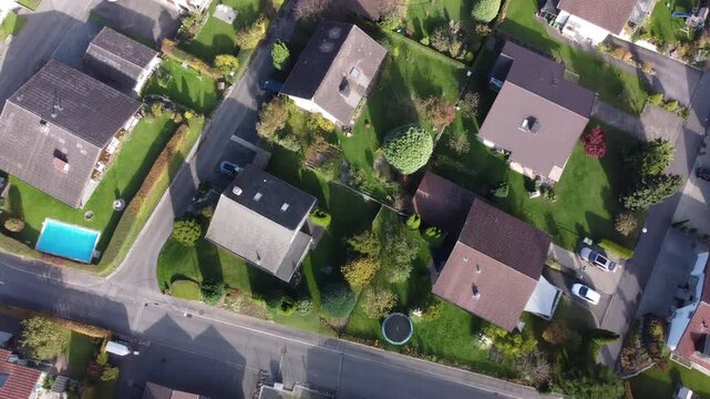 Top view reveals Interlaken nestled between Lake Thun and Lake Brienz. Showcasing the turquoise Aare River, traditional Swiss architecture, and the majestic Bernese Oberland peaks.