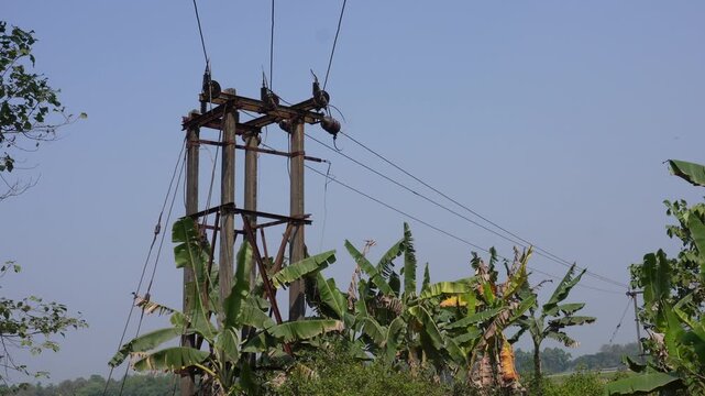 Wooden electricity transmission tower in rural area