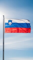 Obraz premium Slovenian Flag Waving in Clear Daylight