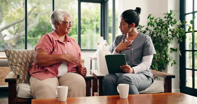Discussion, tablet and old woman with caregiver on sofa, health assessment survey and medical checkup. Elderly care, wellness evaluation or senior person with nurse in home, explain symptoms and tech