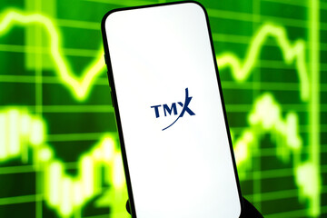 Fototapeta premium TMX Group logo is displayed on the screen of a smartphone, in Bangalore, India, on February 12, 2026
