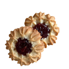 Two baked shortbread cookies with red berry jam filling