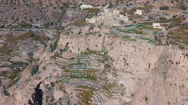 Aerial view of traditional terraced farms with falaj irrigation in Al Shuraijah, Oman
