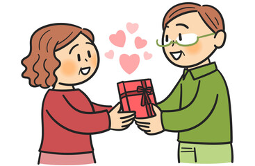 プレゼントを渡して照れ合うシニアのカップル