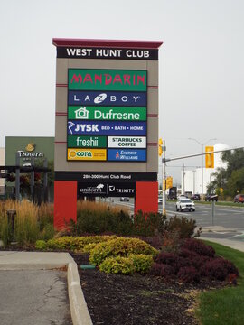 Ottawa, ON, Canada-July 13,2025: A view of the "West Hunt Club commercial plaza pylon sign" displaying various retail logos on W Hunt Club Rd.