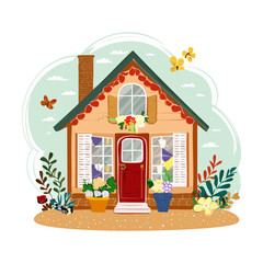 Small house with a red roof and a beautiful garden full of blooming spring flowers Plant © color