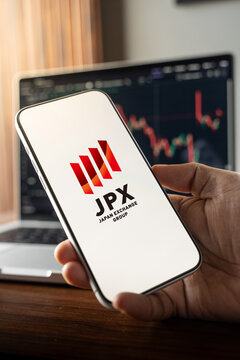 Japan Exchange Group logo is displayed on the screen of a smartphone, in Bangalore, India, on February 12, 2026