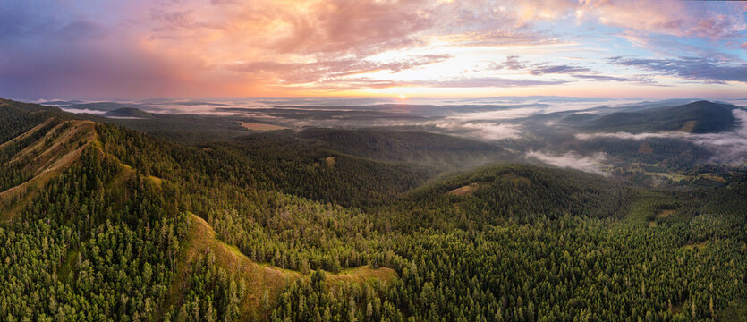 Southern Urals in summer: sunset over the Southern Kraka ridge. Aerial view.