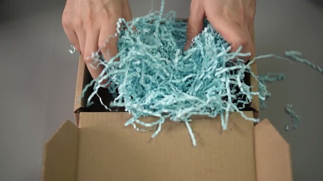 Paper filler. Self-assembly box. Cardboard box. Slow motion video. High quality 4k footage