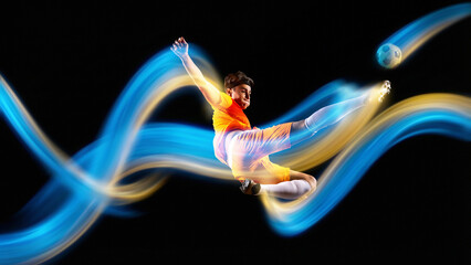 Vivid poster. Soccer player performing flying kick with glowing blue yellow light trails on black. Concept of championship advertising, sports branding, dynamic energy and motion graphics visuals. © Lustre Art Group 