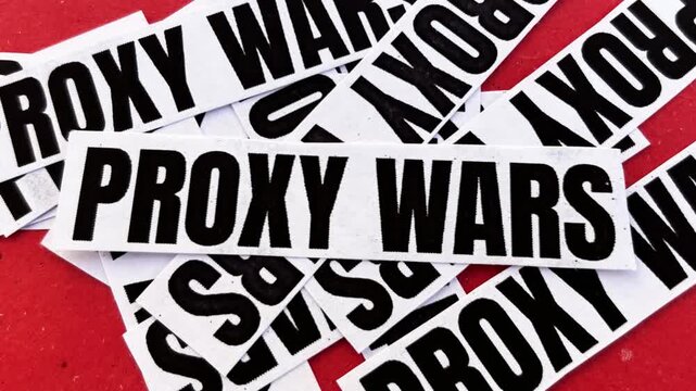 Red background stickers featuring text proxy wars symbolizing political conflict and modern geopolitical indirect warfare, 4k footage