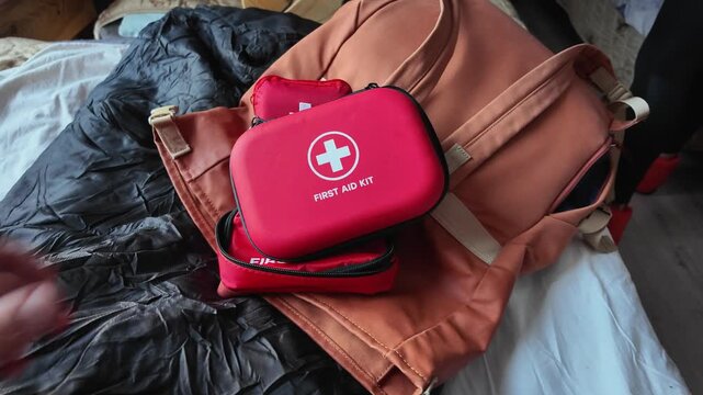 Medical Kit Attached To Backpack Strap, Portable Emergency Medical Pack Close To Sleeping Area And Luggage, First Aid Container Secured On Backpack Strap Beside Bed And Travel Accessories