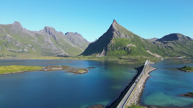 Aerial view of the Fredvang Bridges with the striking peak of Volandstind in the background. Fredvang in the Lofoten Islands in Norway.