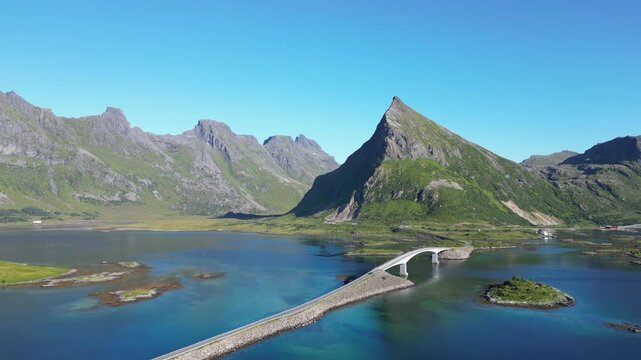 Aerial view of the Fredvang Bridges with the striking peak of Volandstind in the background. Fredvang in the Lofoten Islands in Norway.