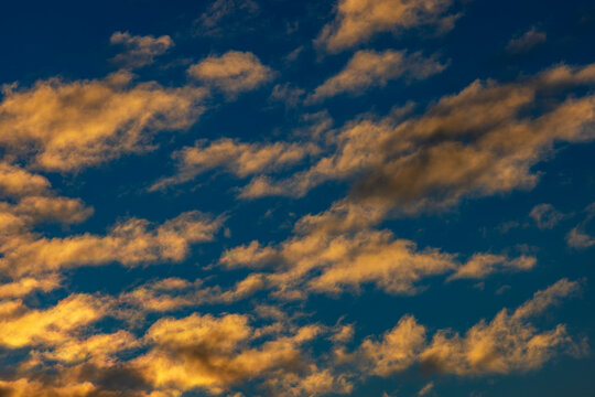 Scattered cloudscape in golden evening light in Upper Austria