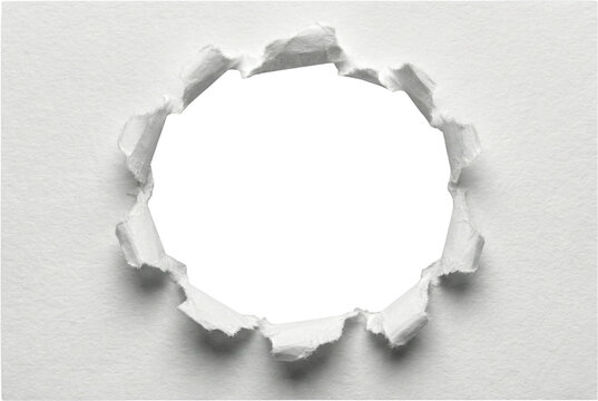 Ripped circular hole in center of white textured paper