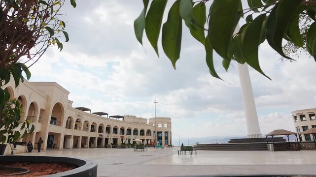 Aqaba, Jordan - 10th december, 2025: time lapse view Arab Revolt Plaza Aqaba Jordan city square with monumental flagpole historic landmark Red Sea coastal tourism destination modern architecture