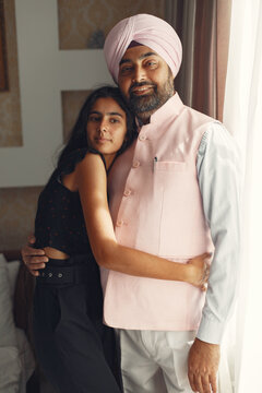 Portrait of Indian sikh man in turban with daughter