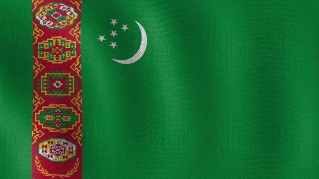 The flag of Turkmenistan waving, featuring a green background with a vertical red stripe and traditional patterns, a crescent moon, and five white stars, symbolizing national pride and cultural