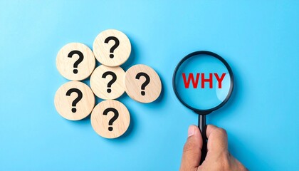 Wooden circular tokens with question marks arranged on blue background with magnifying glass highlighting word why in red symbolizing inquiry investigation and search for meaning
